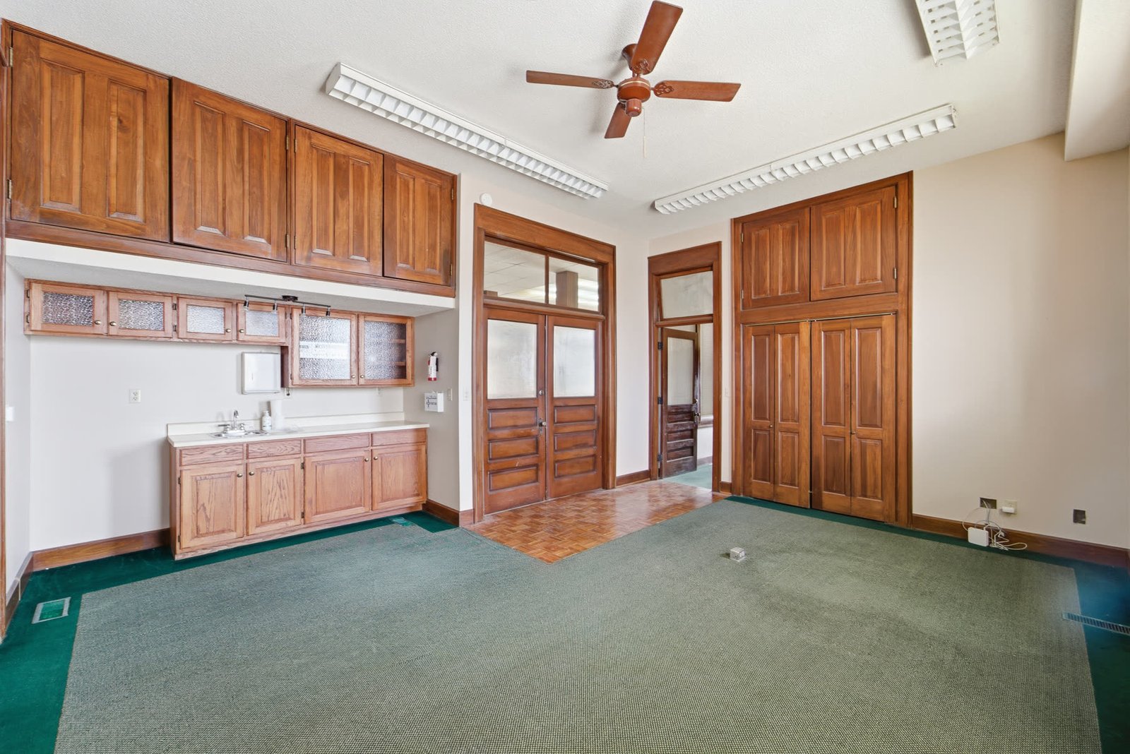 Character room with wood-trimmed windows