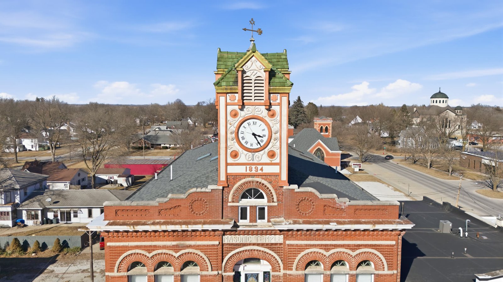 The 1894 clock tower and datestone, Romanesque and Colonial Revival detailing